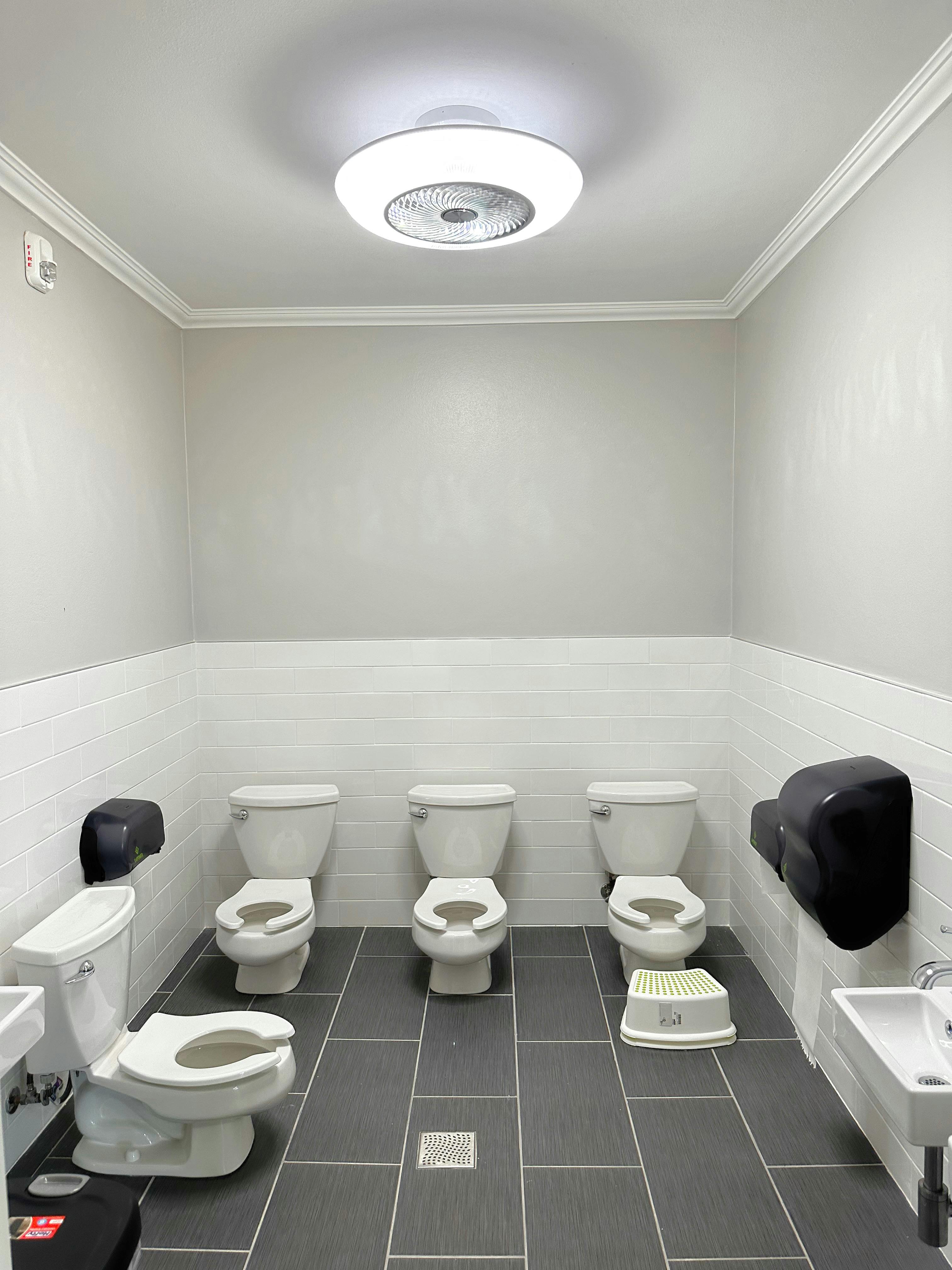 Children's toilets in a row in a bathroom