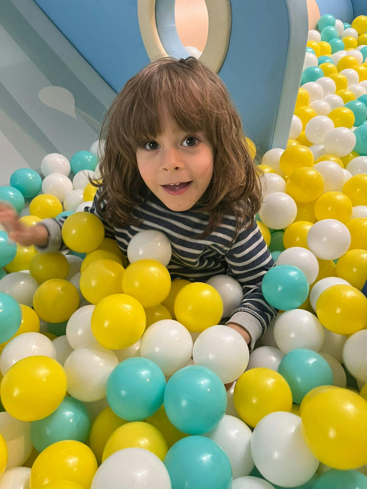 Child in a ball pit