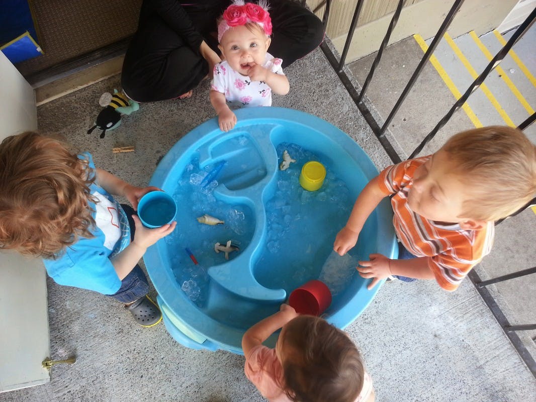 Children playing with a water table