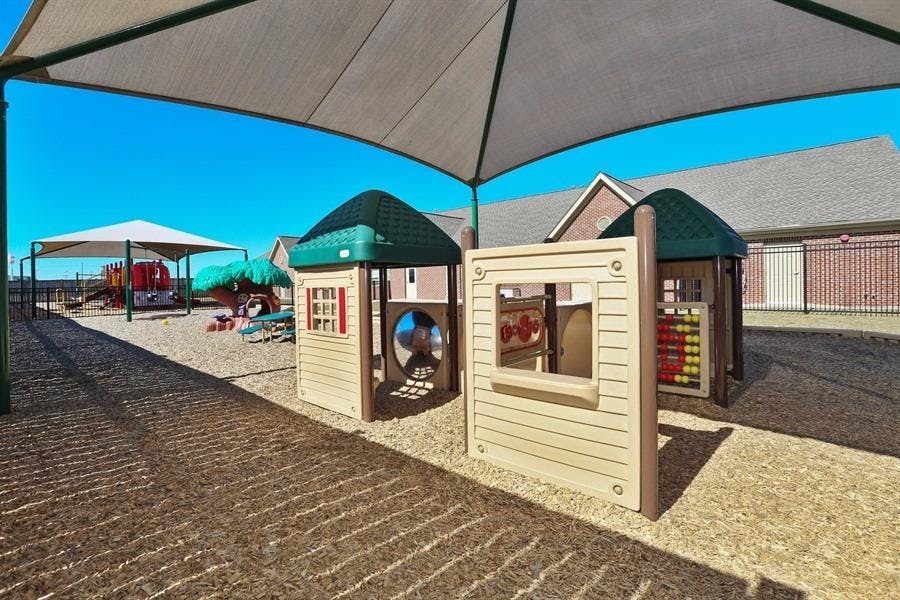 Playground with playhouses and shade structures