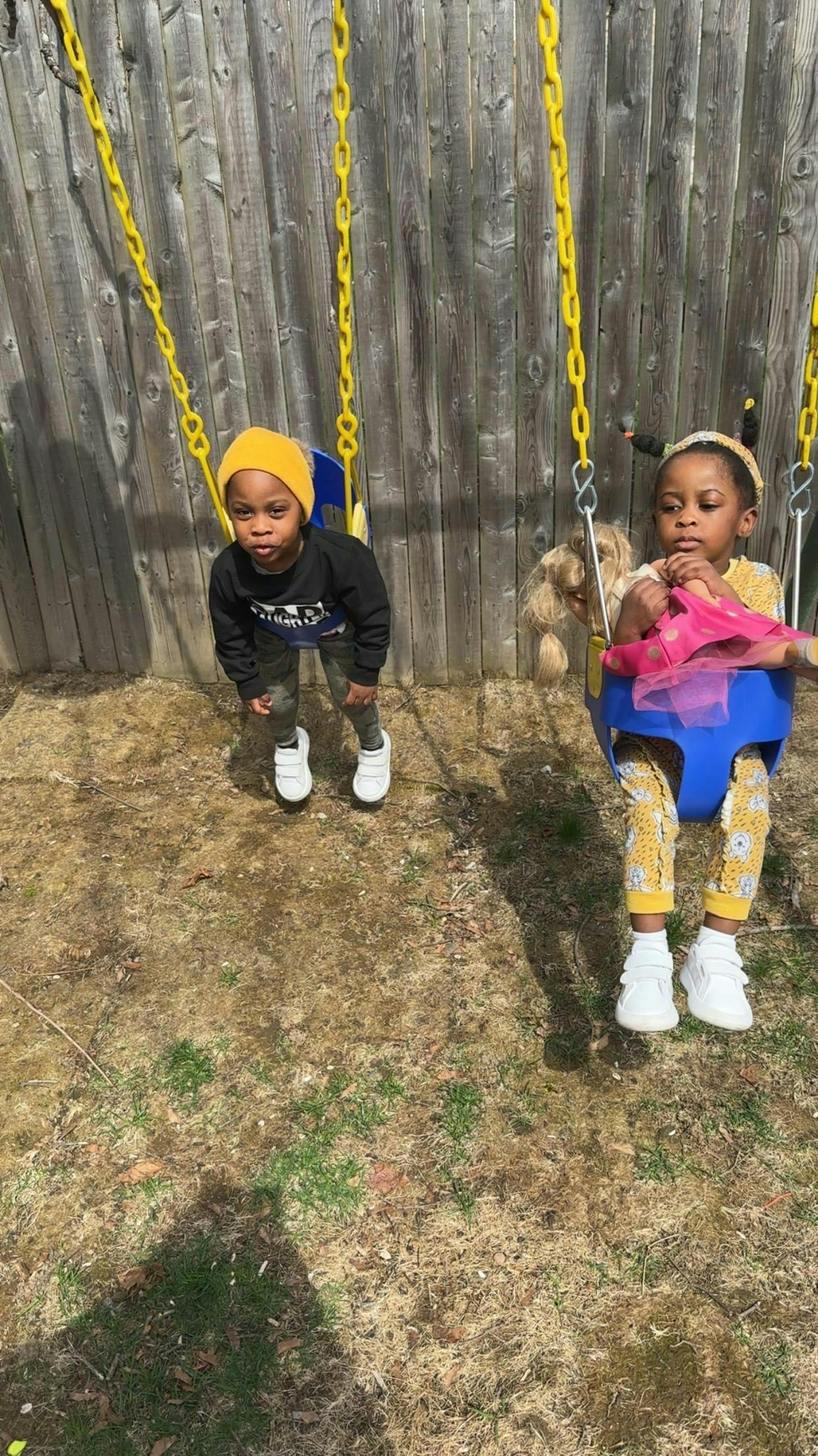 Two children on swings