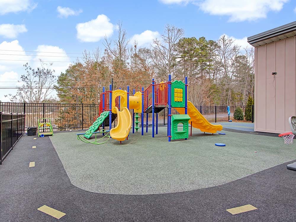 Colorful outdoor playground with slides and climbing structures