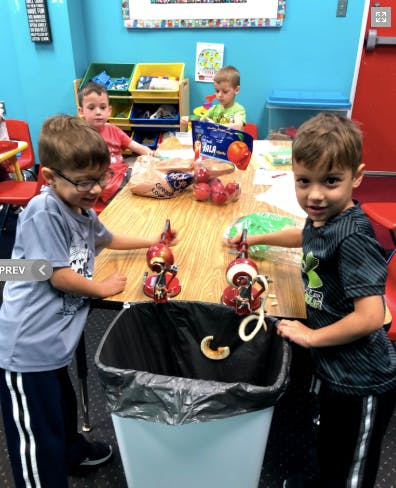 Children playing with toys at a table
