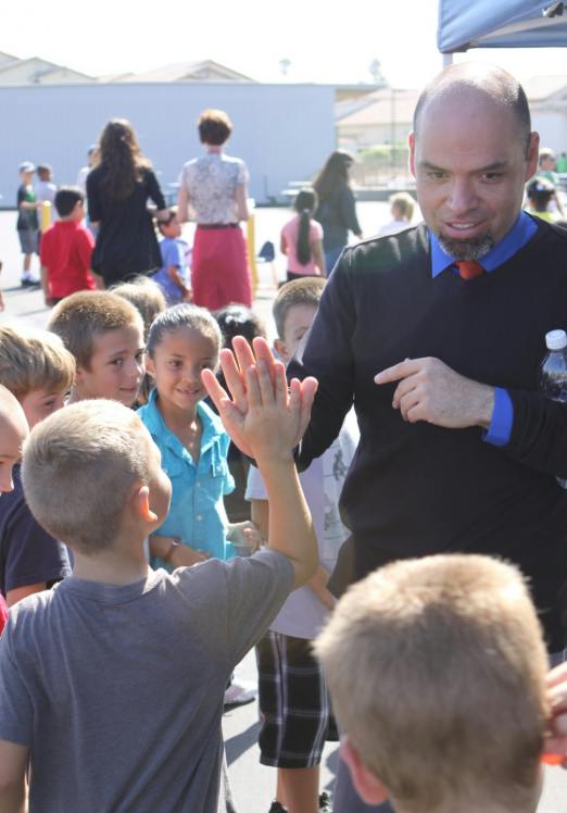 Adult person giving a high five to a child