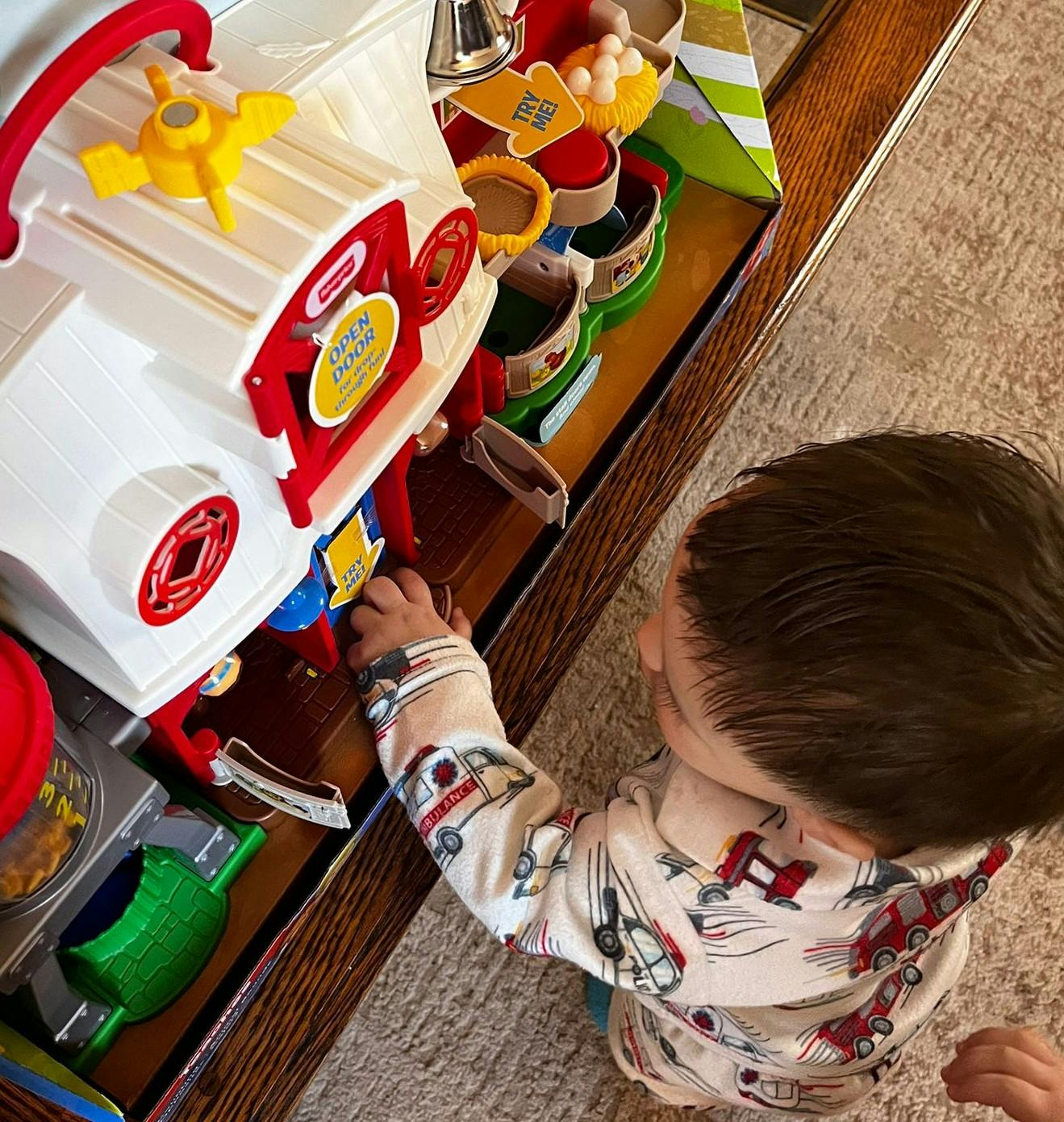 Child playing with a toy farm set
