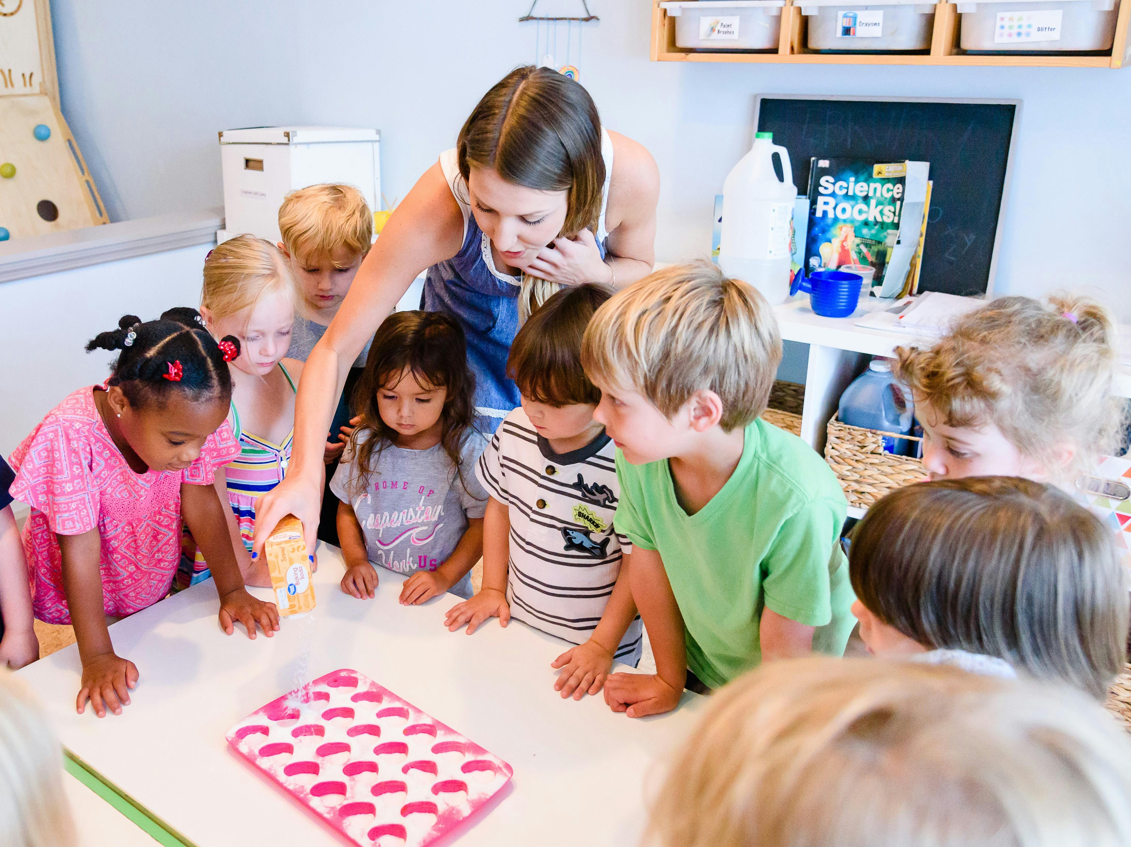 Adult and children gathered around a table