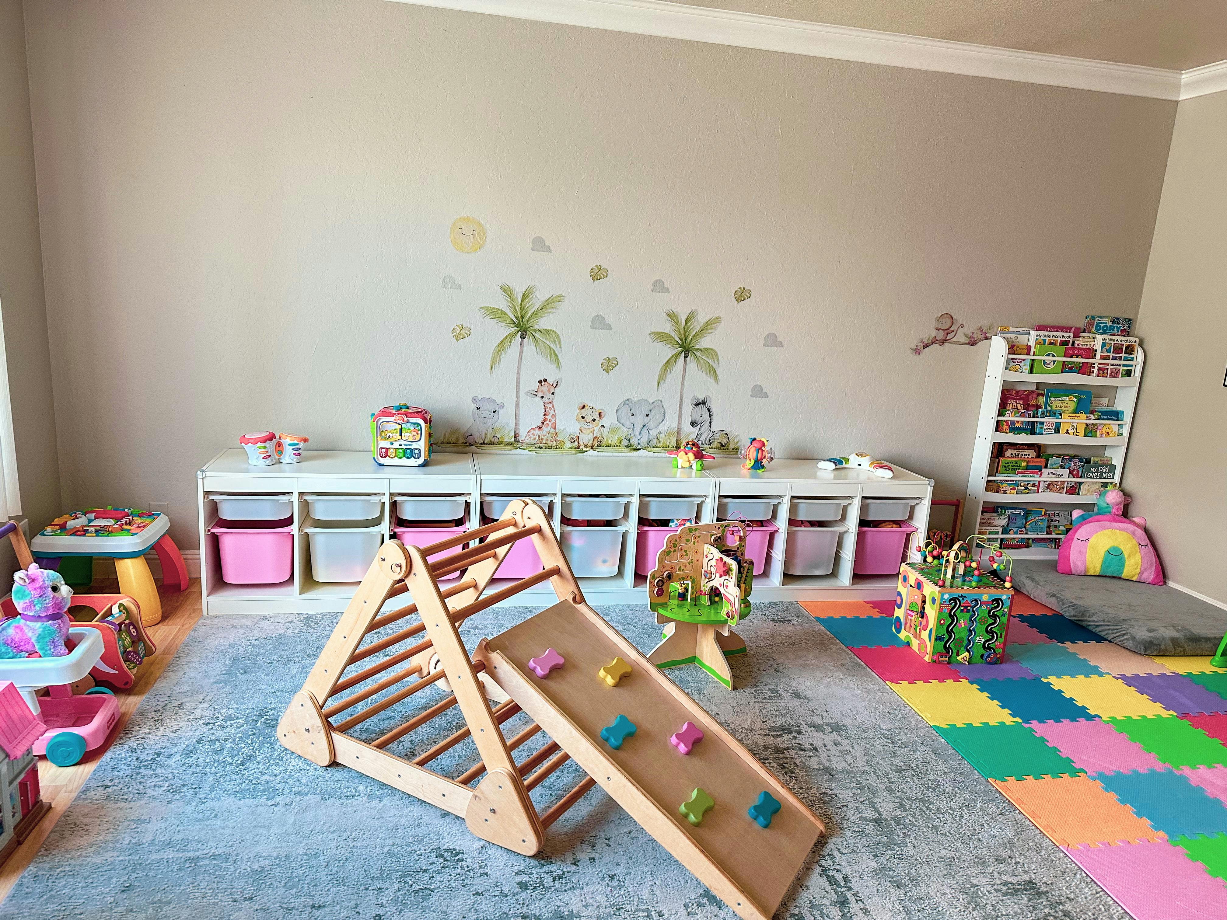 Children's play area with a wooden climbing frame and slide