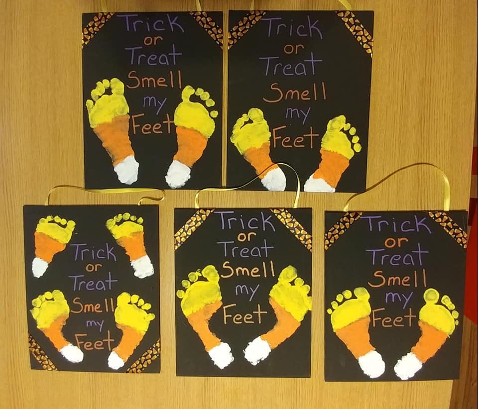 Multiple Halloween crafts with candy corn foot prints and "Trick or Treat Smell my Feet" text