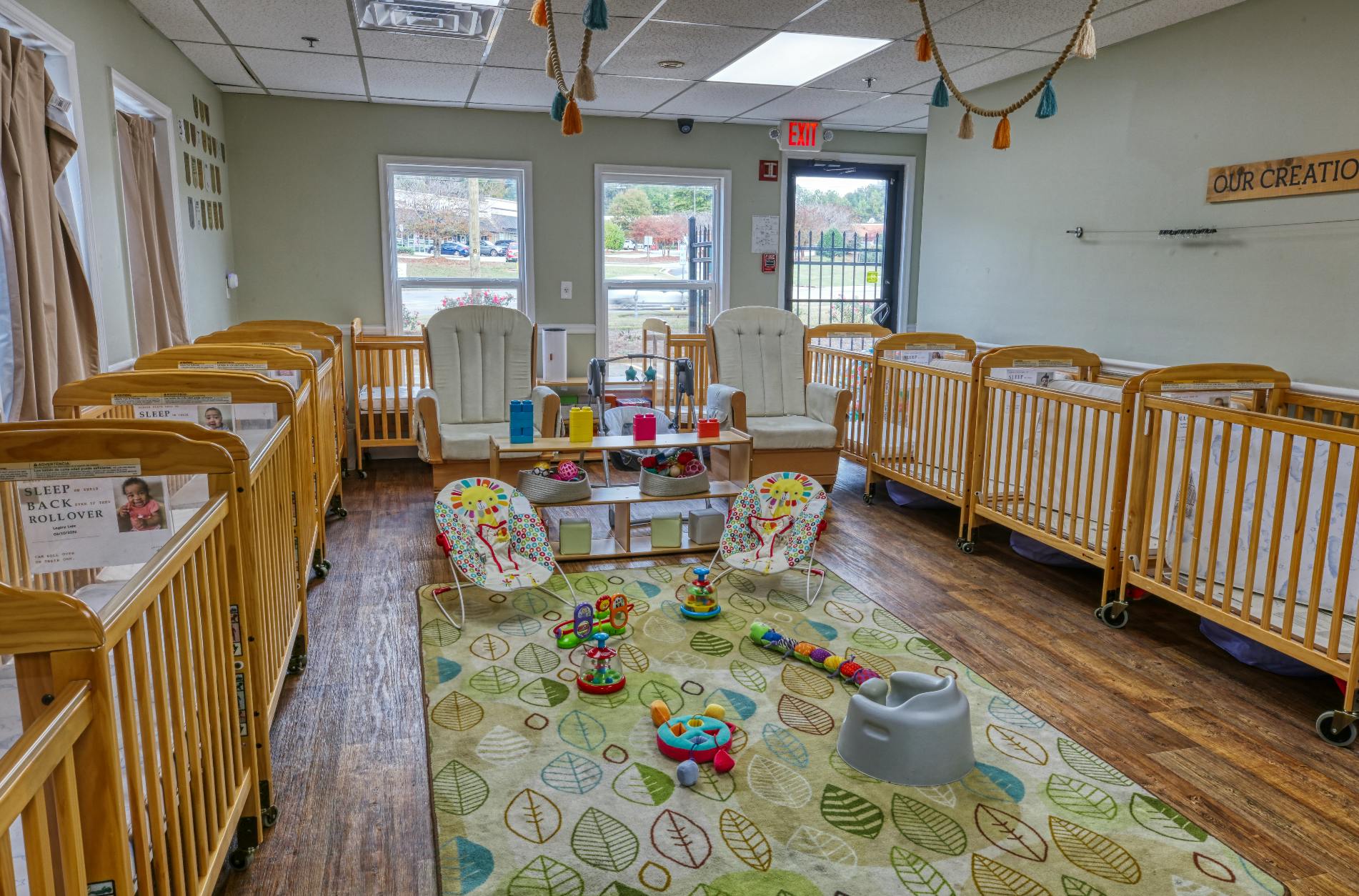 cribs in a daycare room