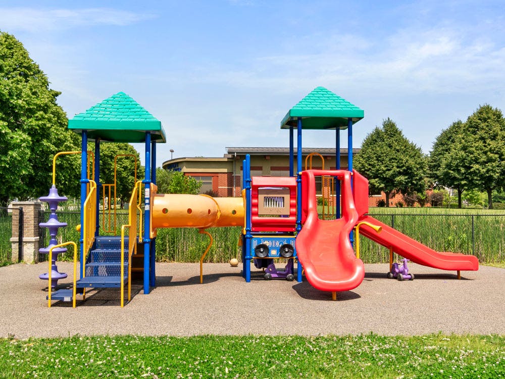 Colorful empty playground set with slides and tunnels