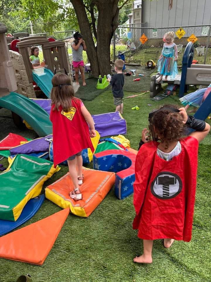 Children playing in costume on a playground