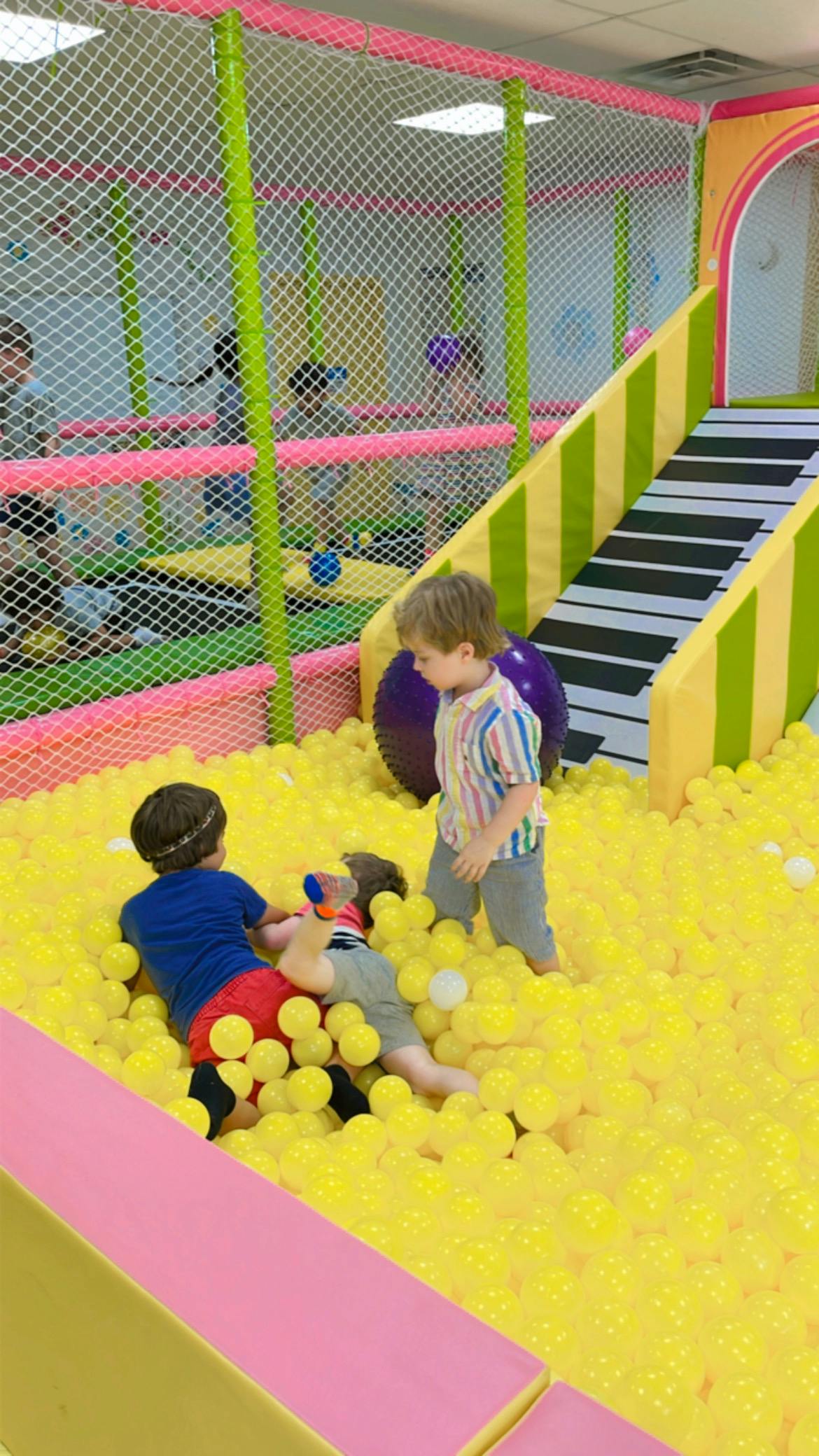 Children playing in a ball pit