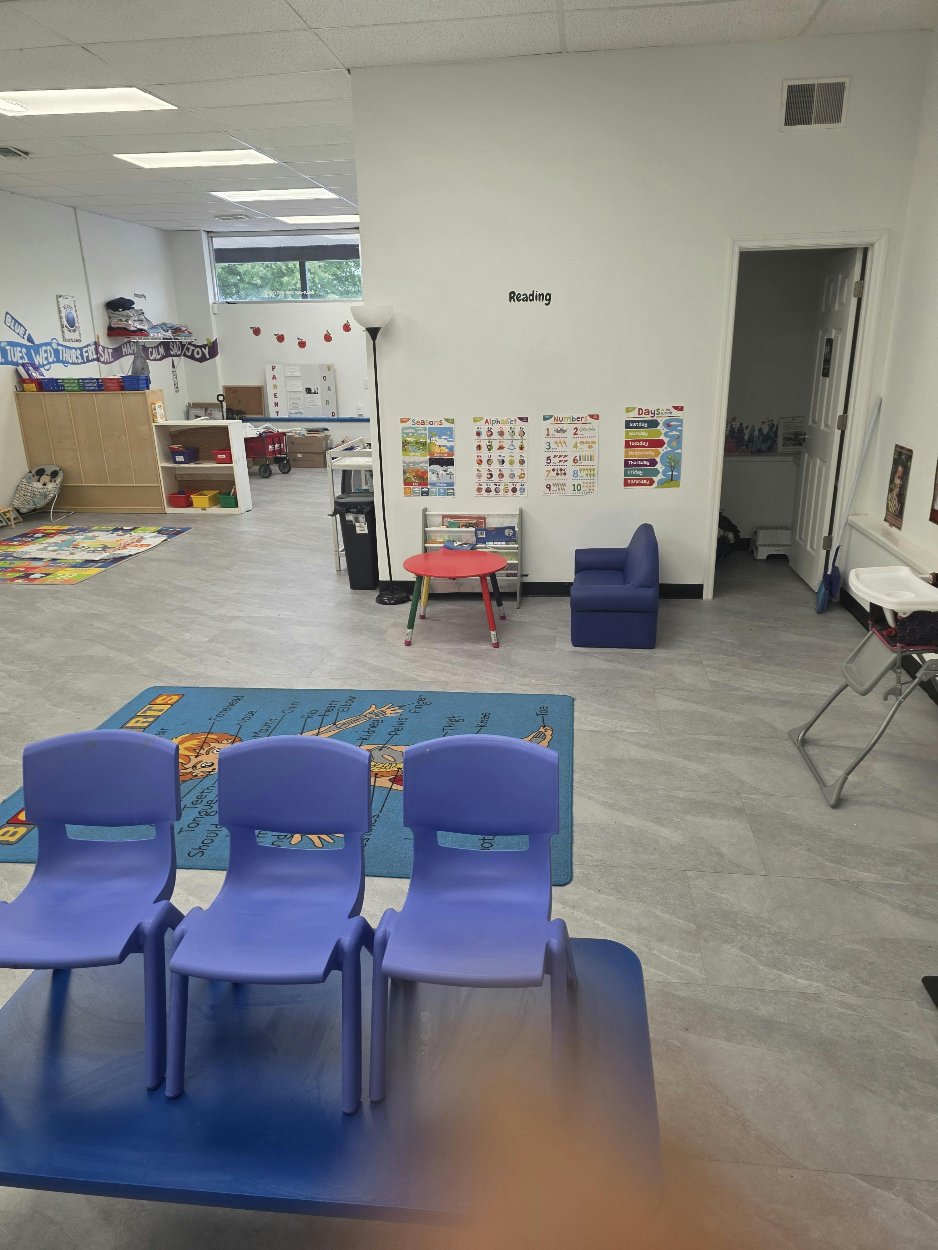 Classroom interior with small chairs and educational wall charts