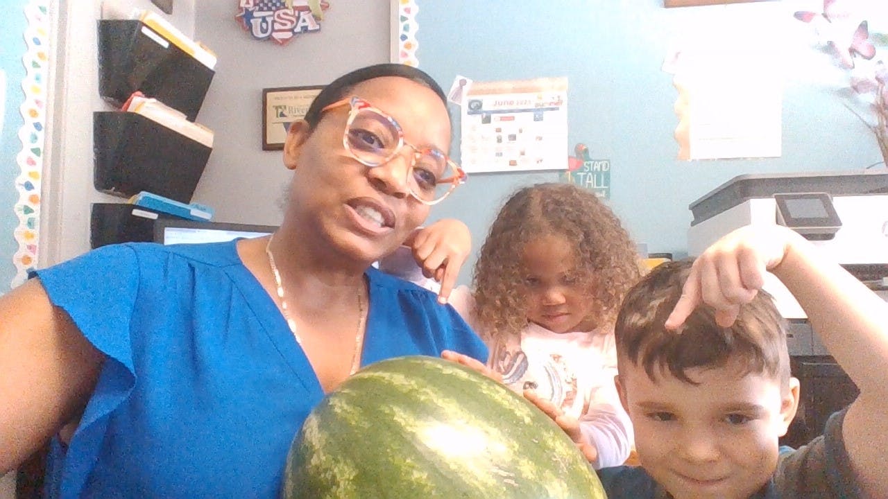 Person holding a watermelon with two children