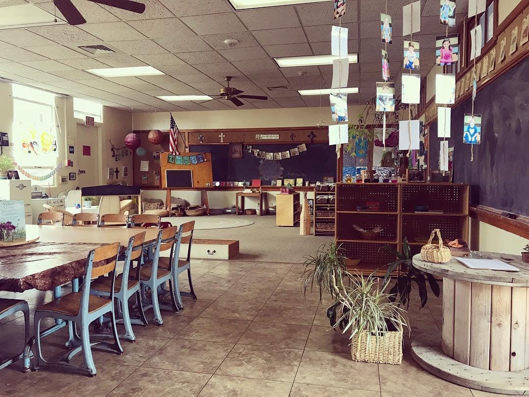 Empty classroom with tables and chairs