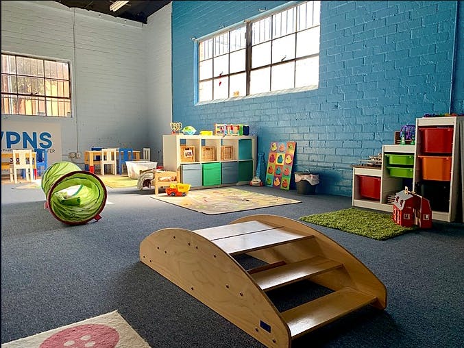 Playroom with various toys and furniture