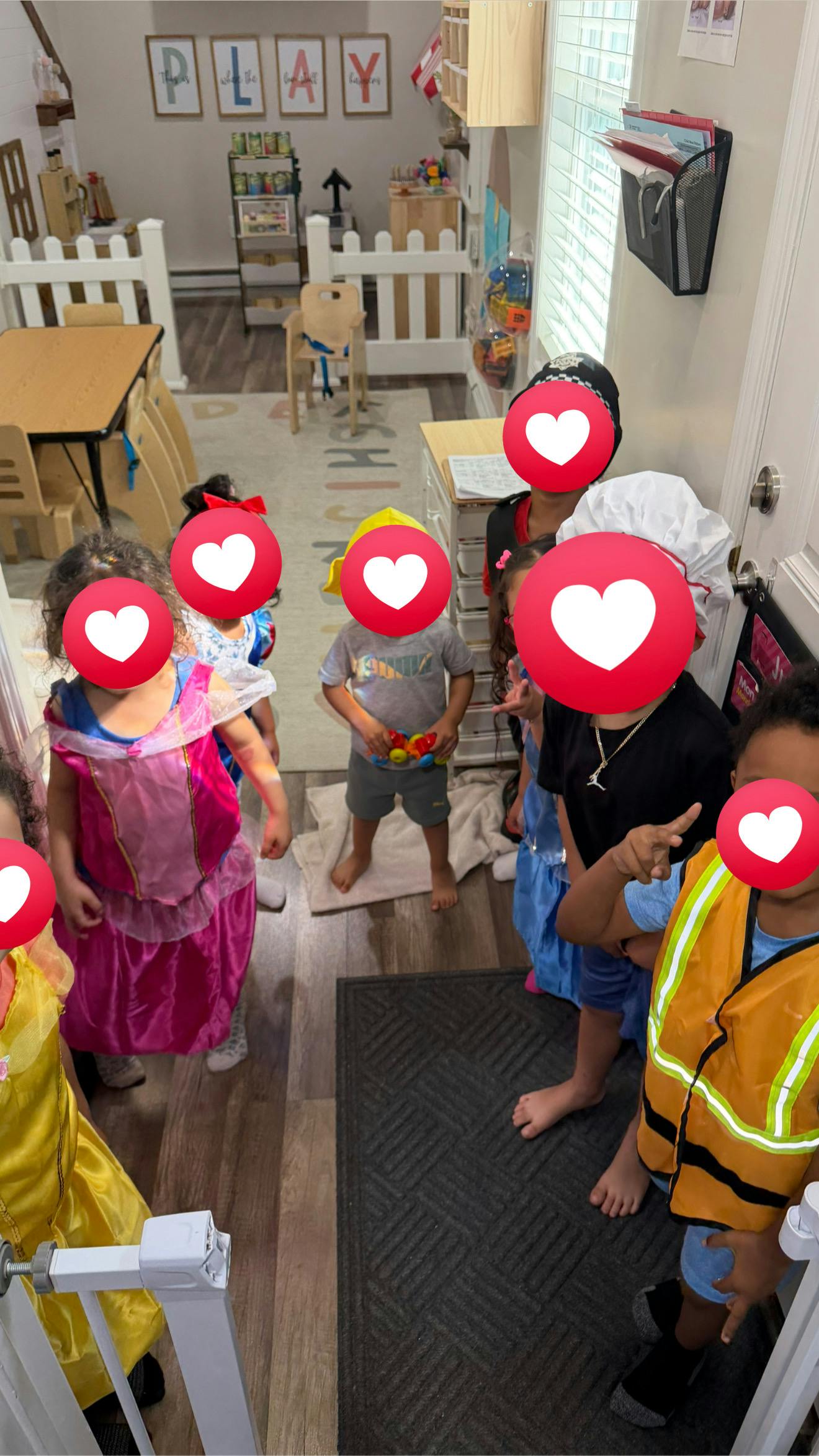 Group of children wearing costumes in a playroom