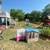 Outdoor play area with a small pool and various toys