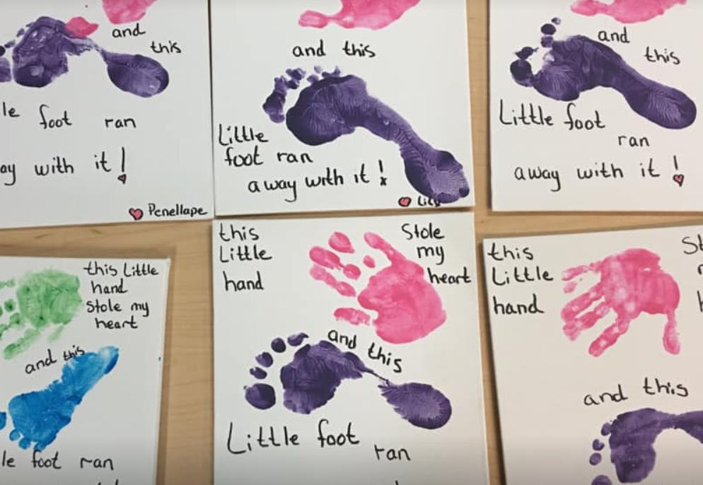Multiple cards with child handprints and footprints, some with text
