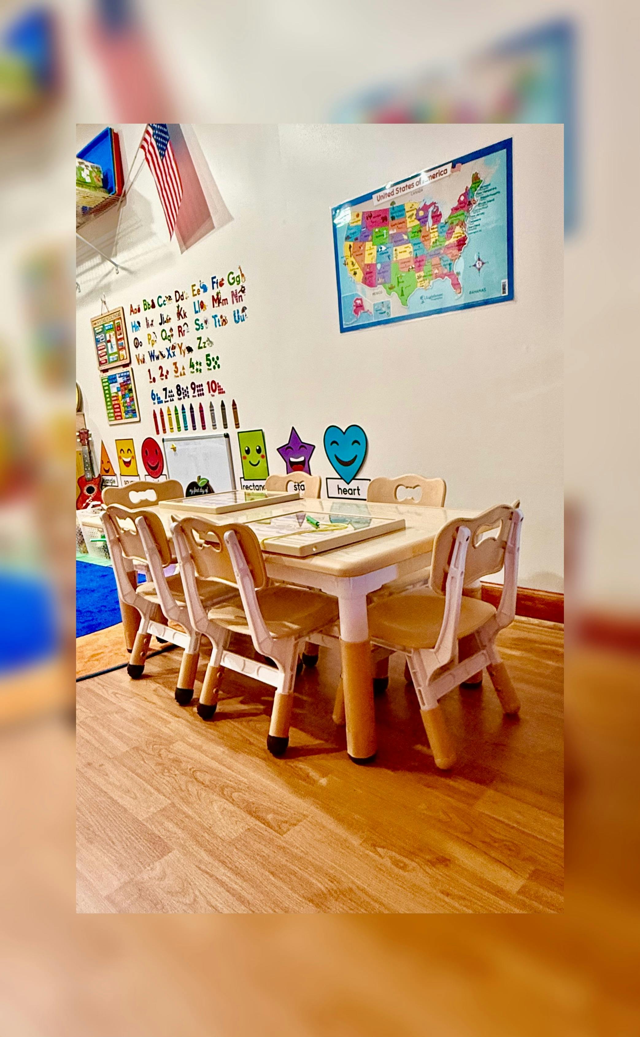 Small table and chairs for children in a classroom setting