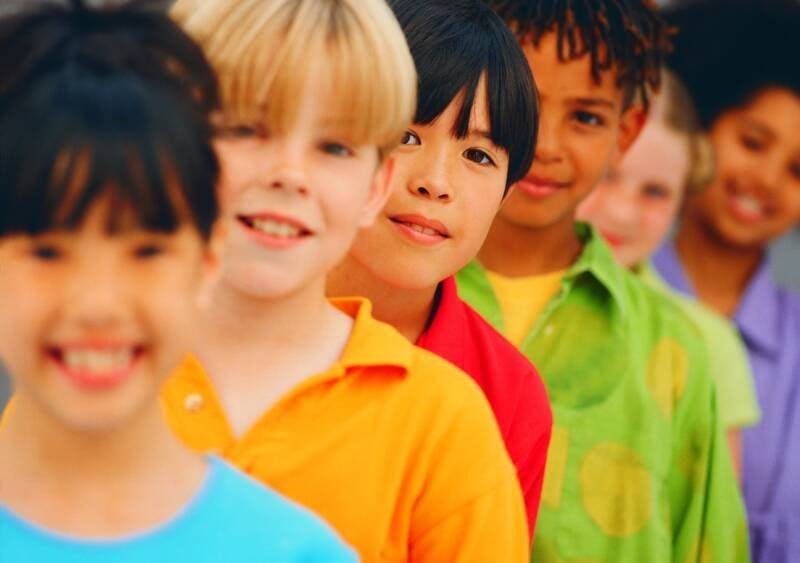 Line of children looking at the camera