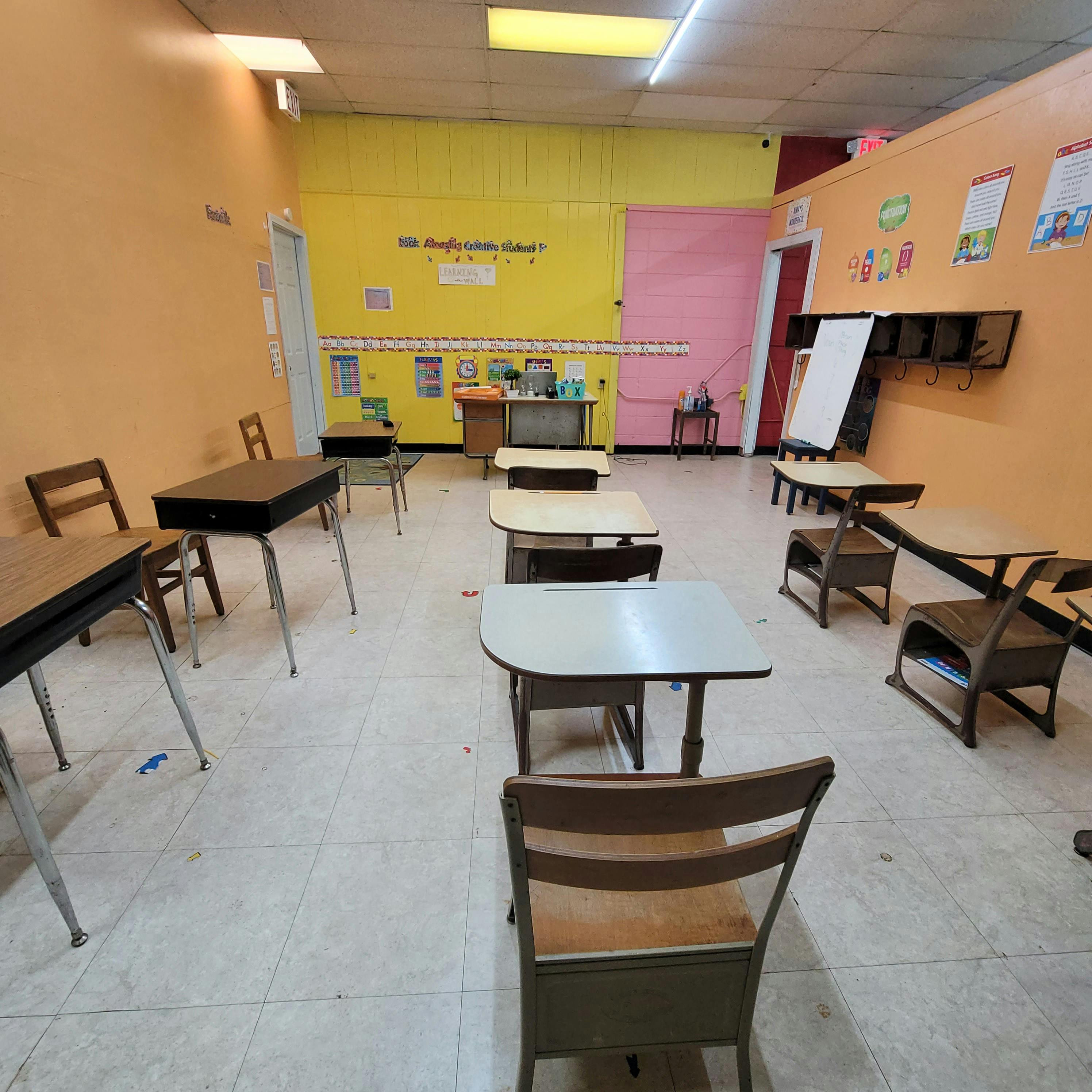 Empty classroom with desks and chairs