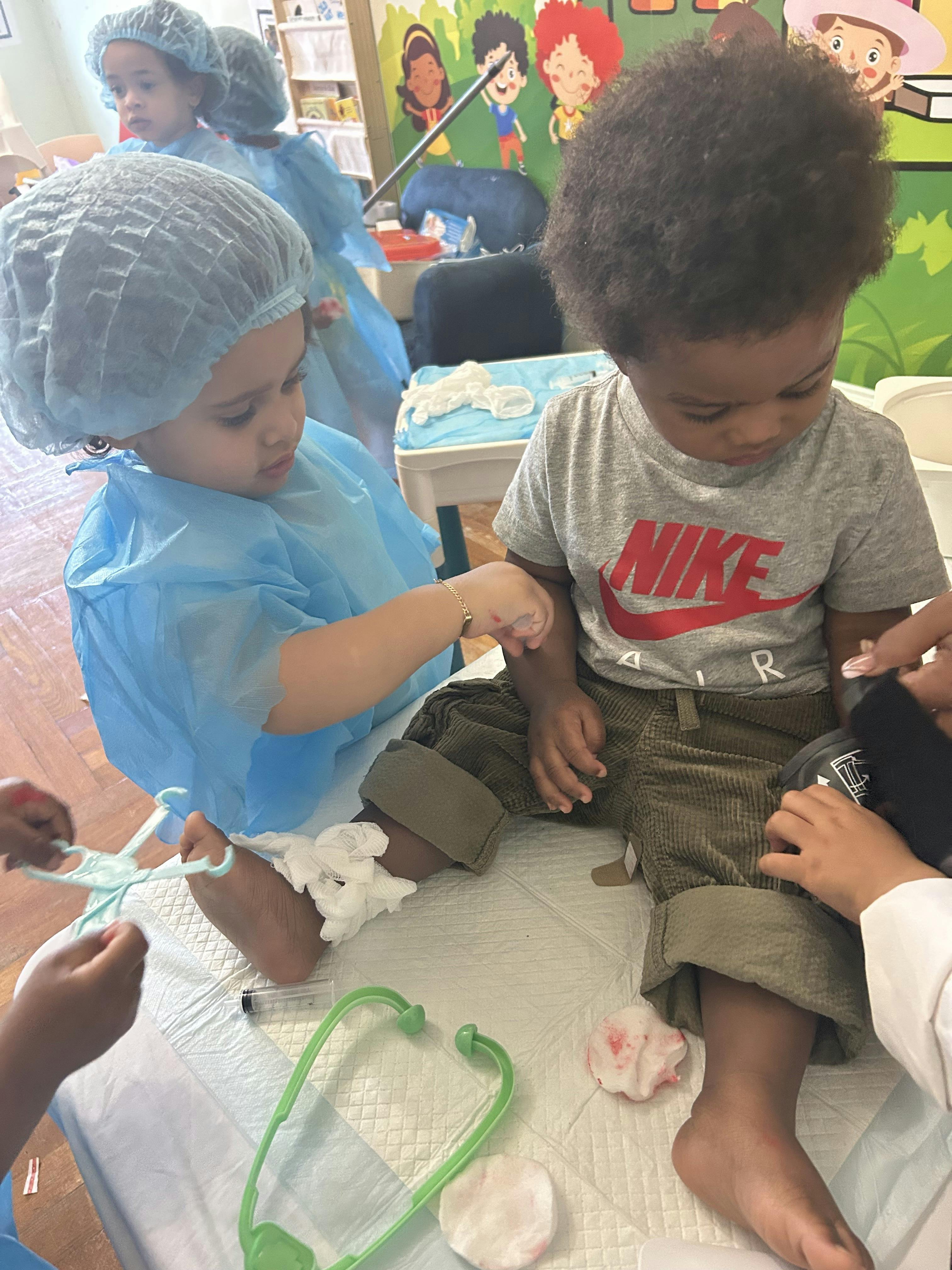 Children playing with toy medical equipment