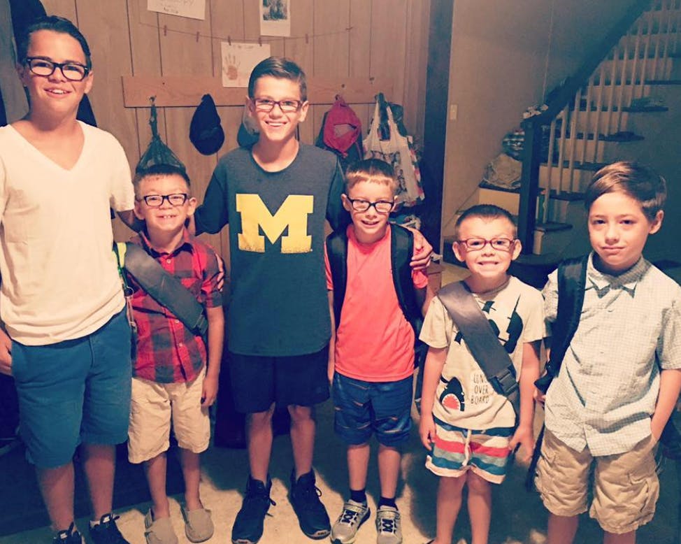 Group of children wearing backpacks