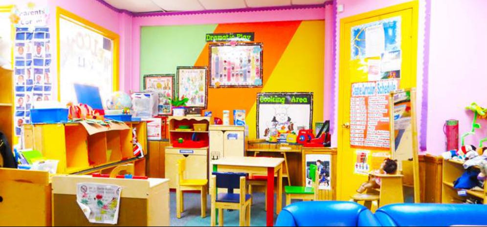 Colorful classroom with small tables and chairs