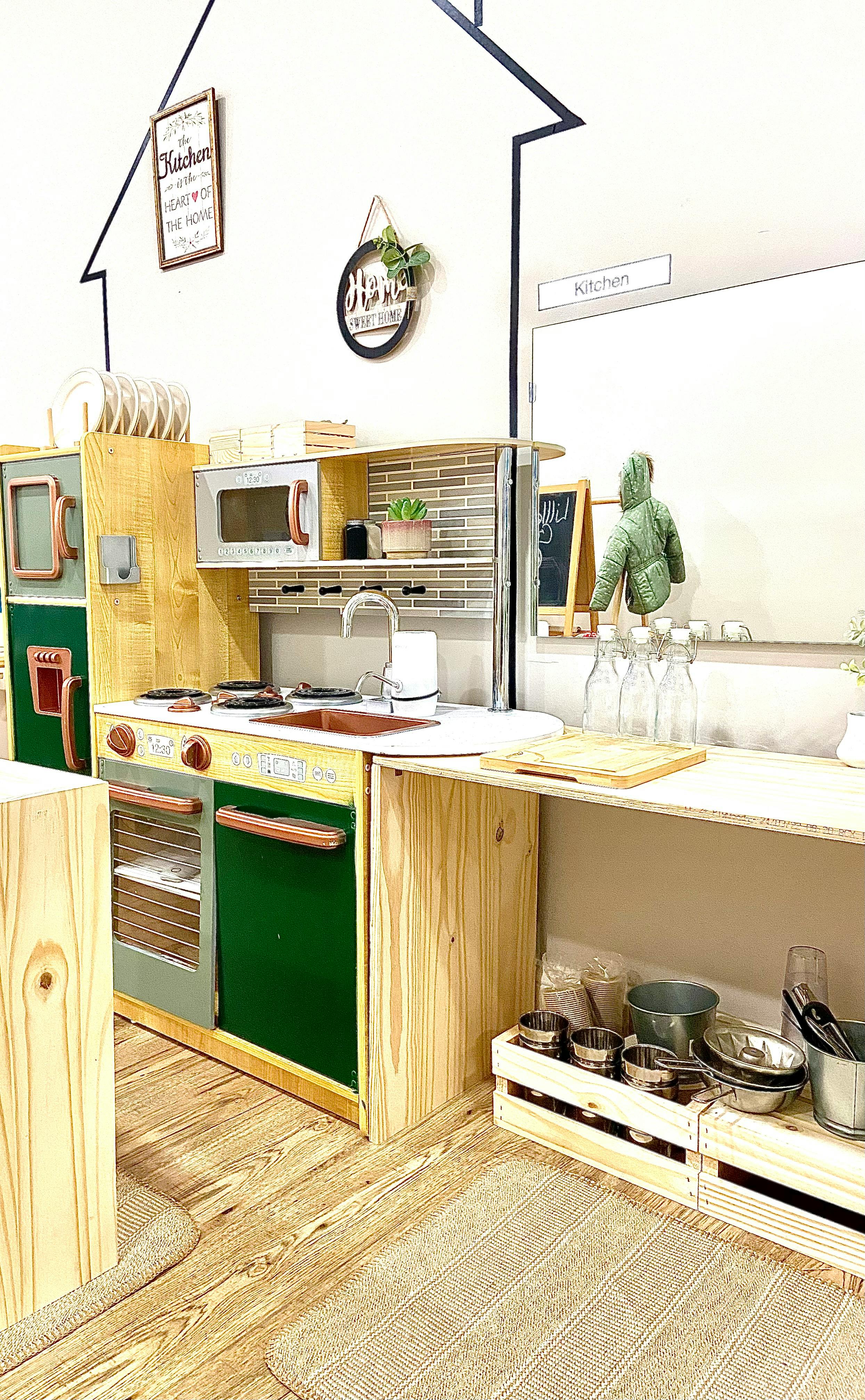 Play kitchen with green oven and microwave