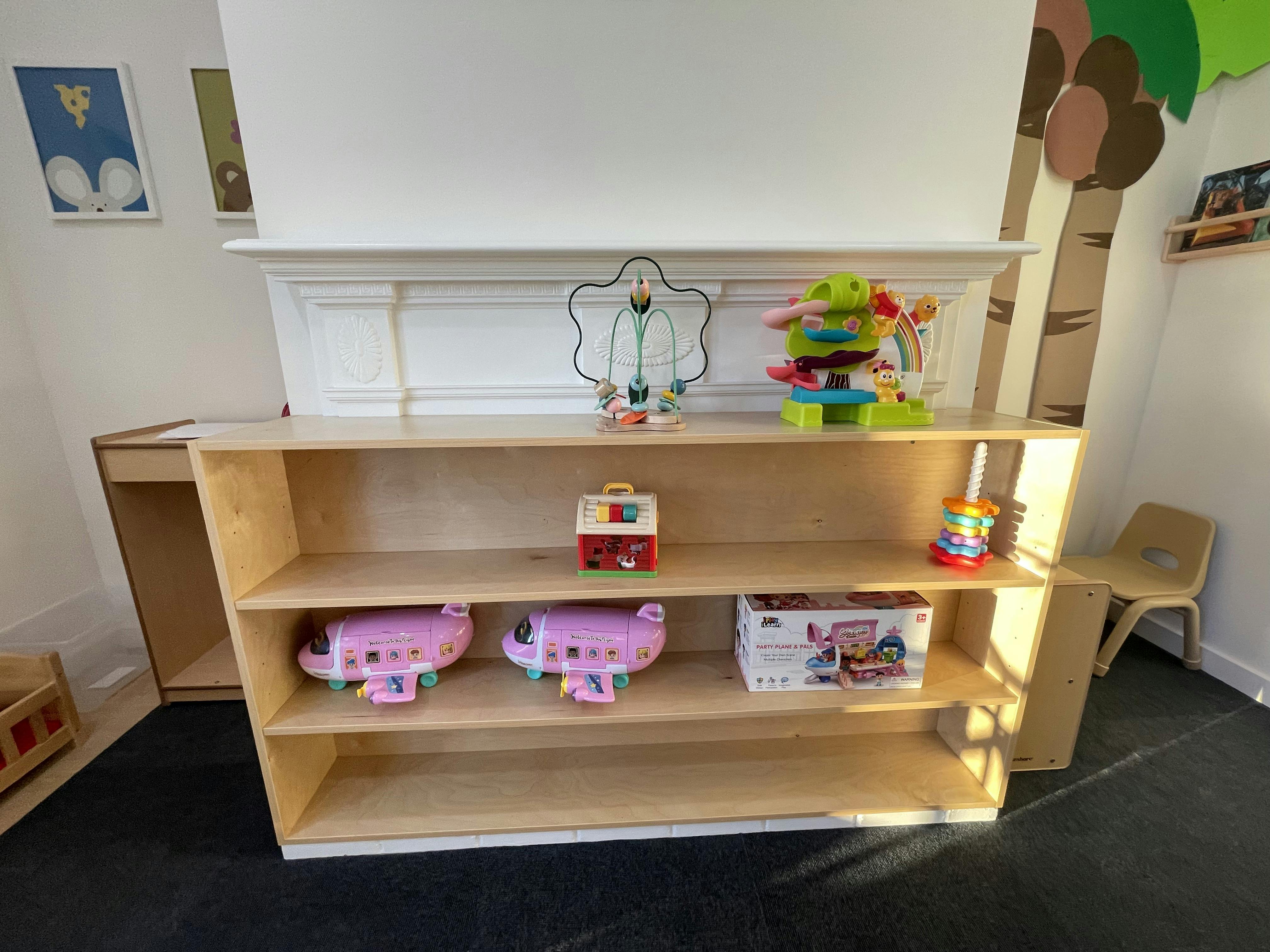 Wooden shelves with toys in a classroom