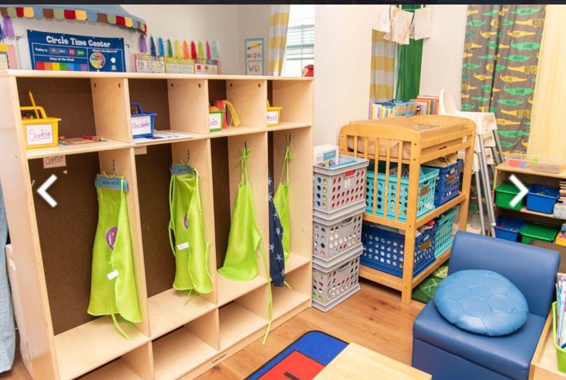 Classroom with cubbies, storage, and a small blue chair