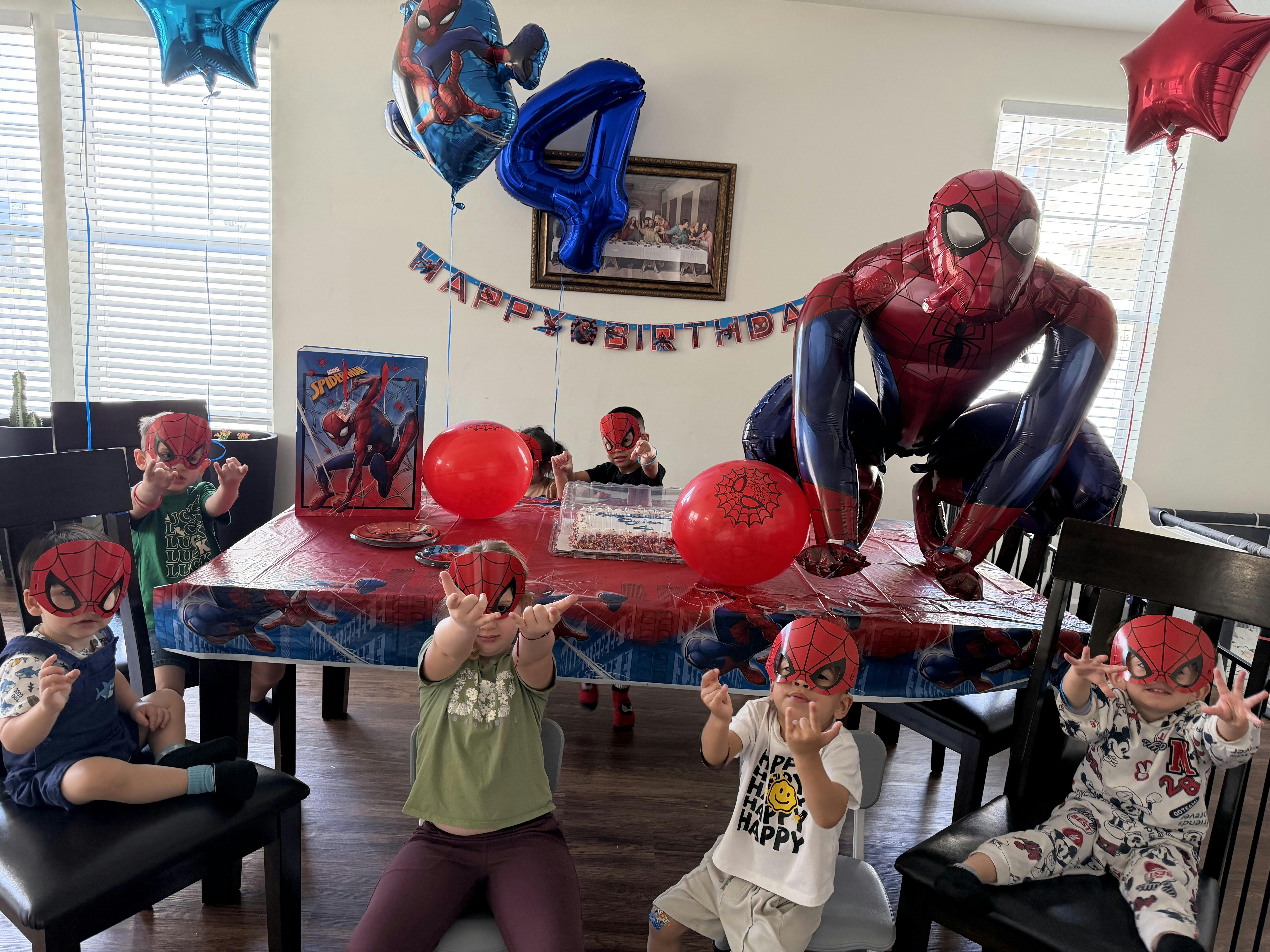 Group of children wearing Spider-Man masks at a birthday party