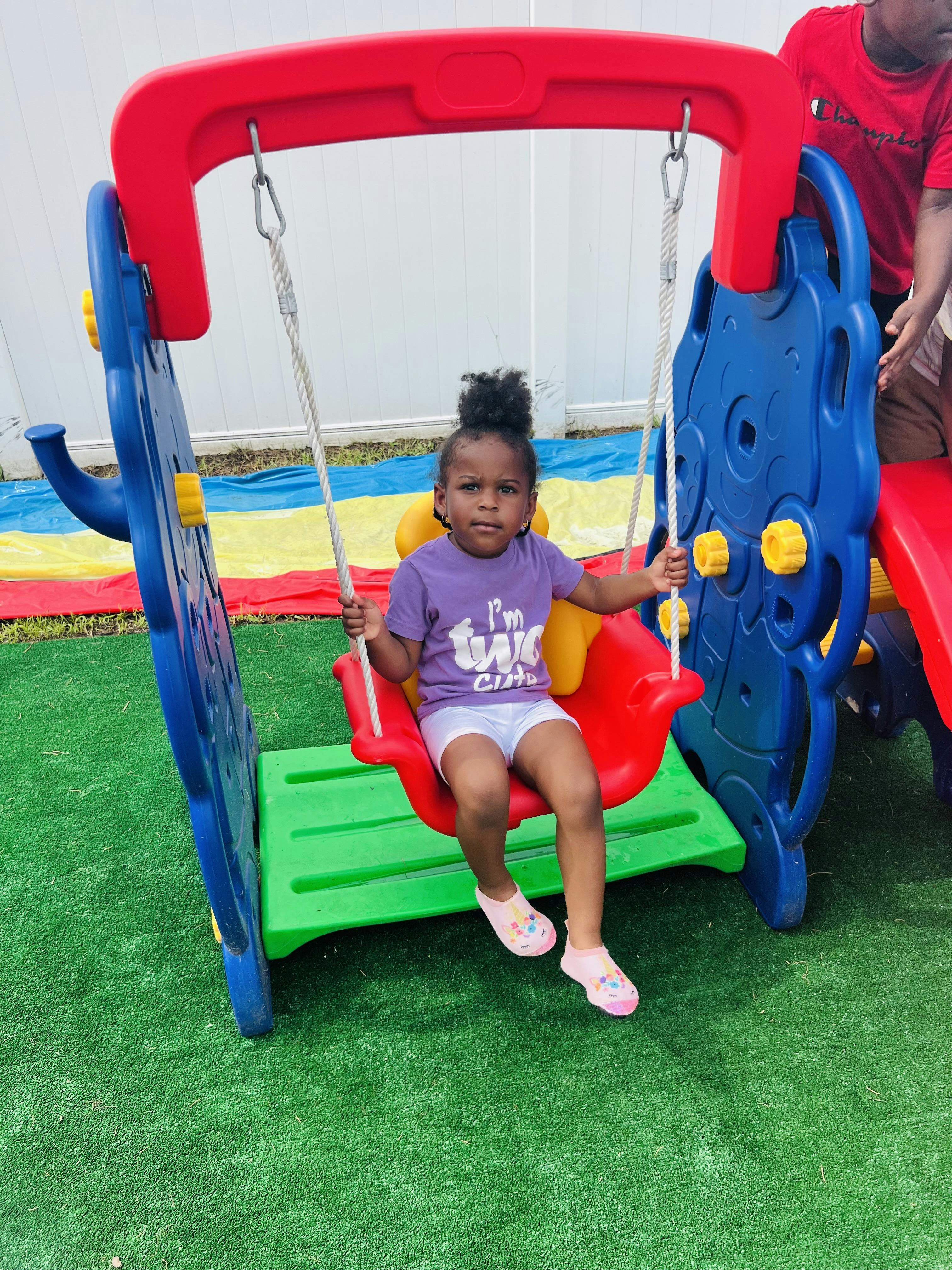 Child sitting on a swing