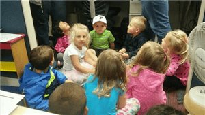 Children sitting in a circle on the floor
