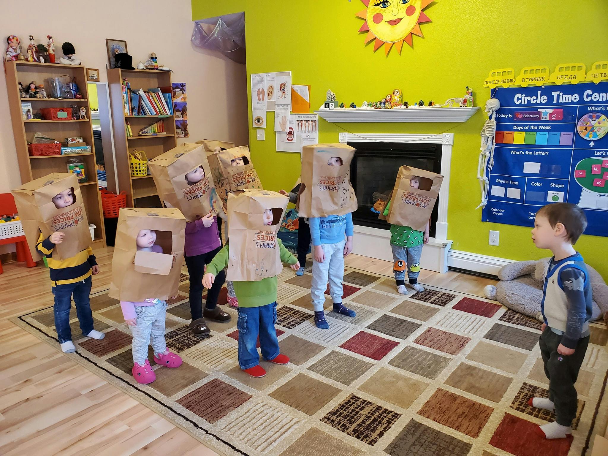 Children wearing paper bag costumes in a classroom