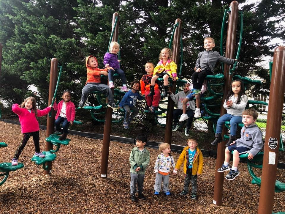 Children playing on a playground structure
