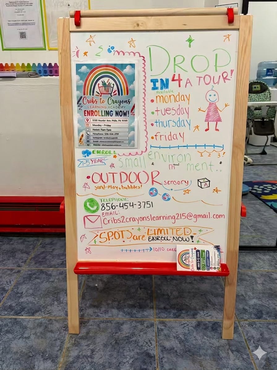 Whiteboard with handwritten information about enrollment for a learning academy
