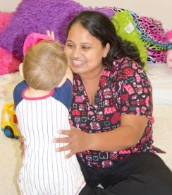 Adult and child interacting
