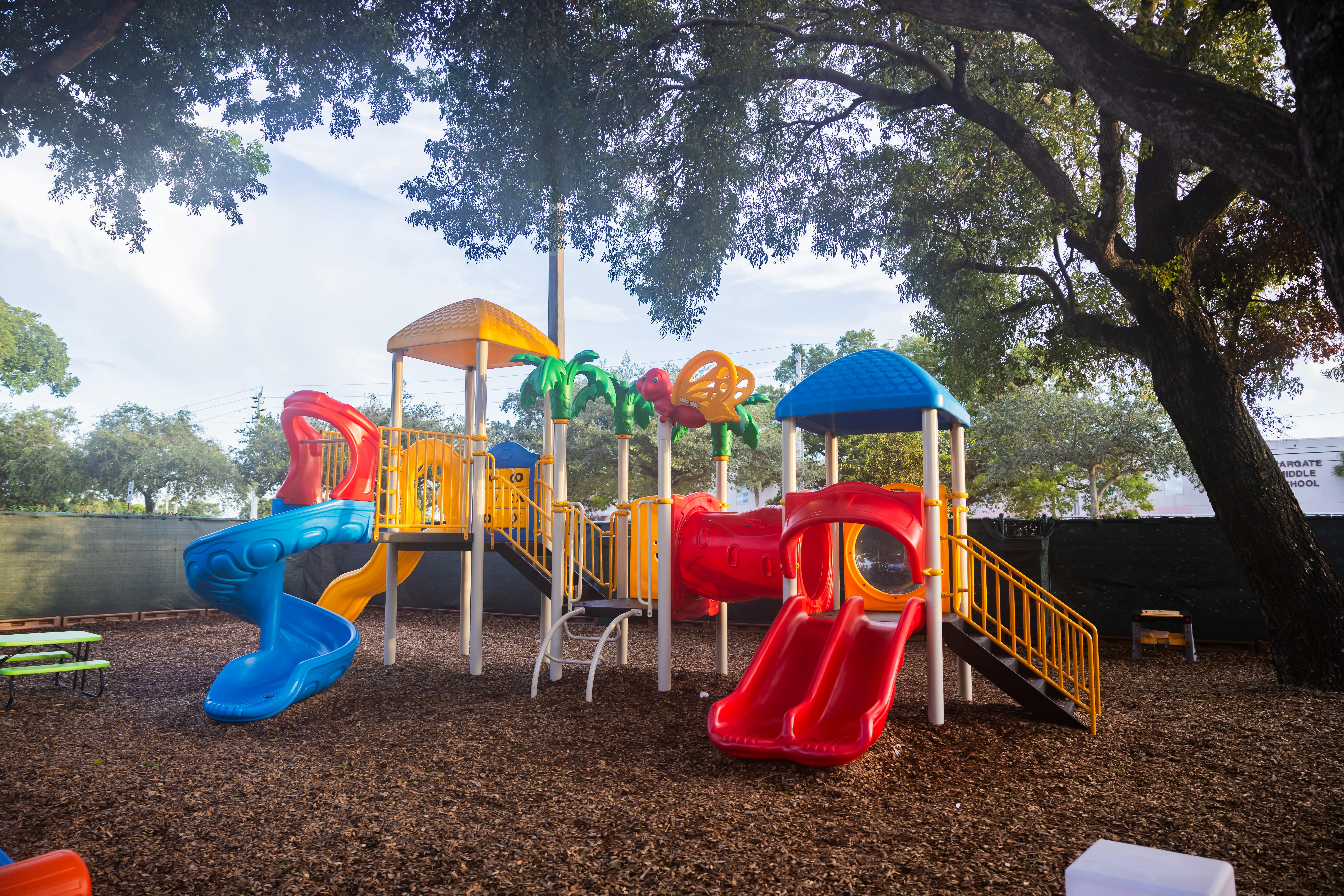 Colorful playground structure with slides and climbing areas