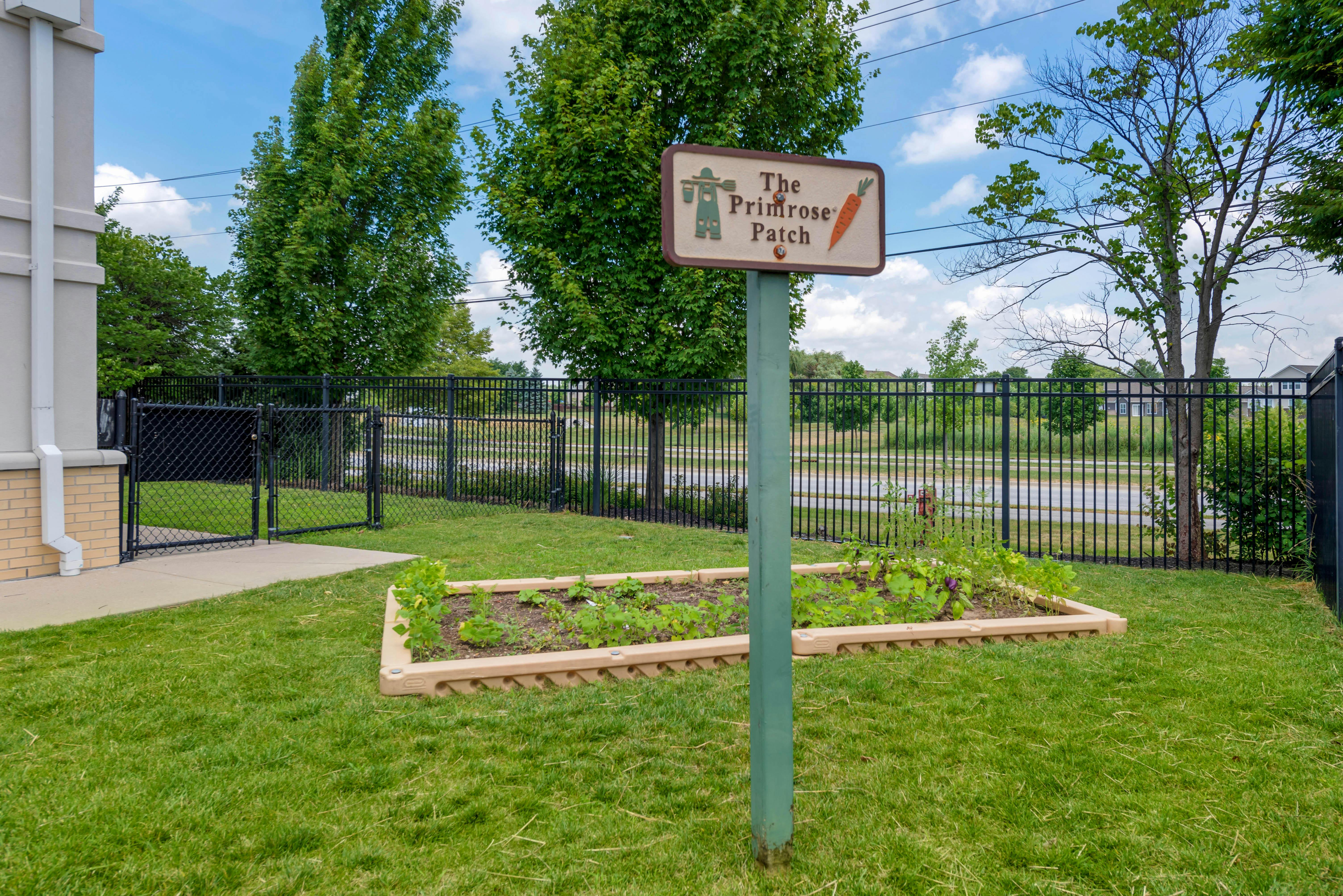 Garden bed with a sign that reads "The Polestone Patch"