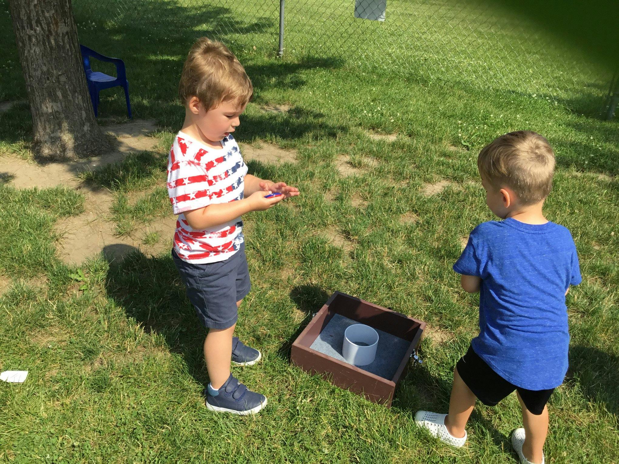 Two children playing a game outdoors