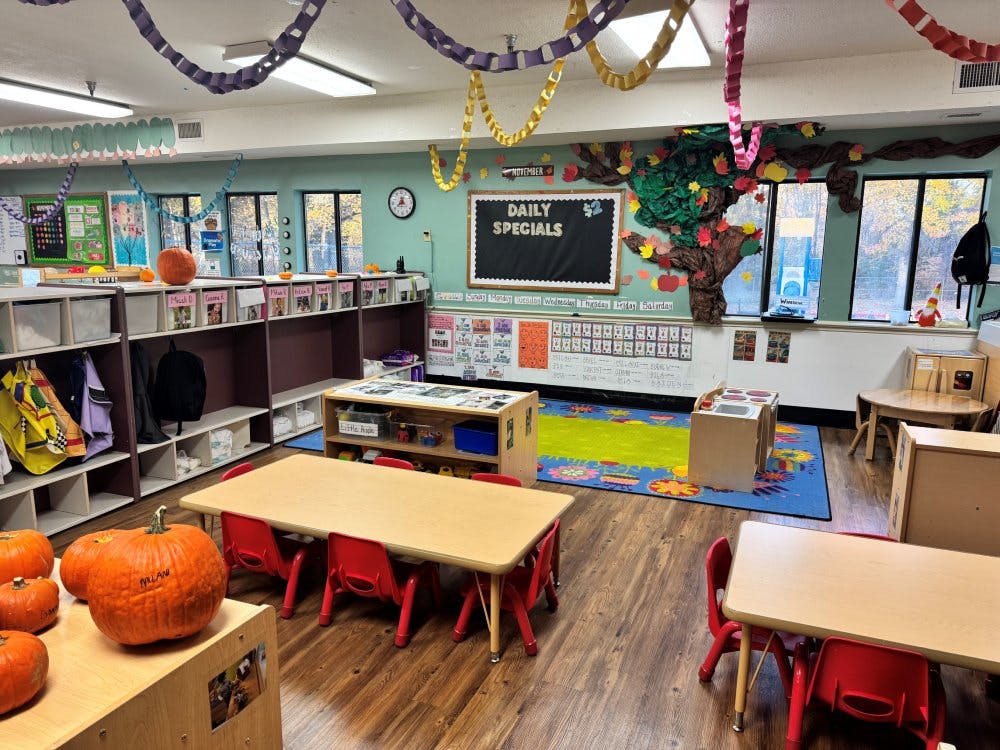 An empty classroom decorated with pumpkins and paper chains