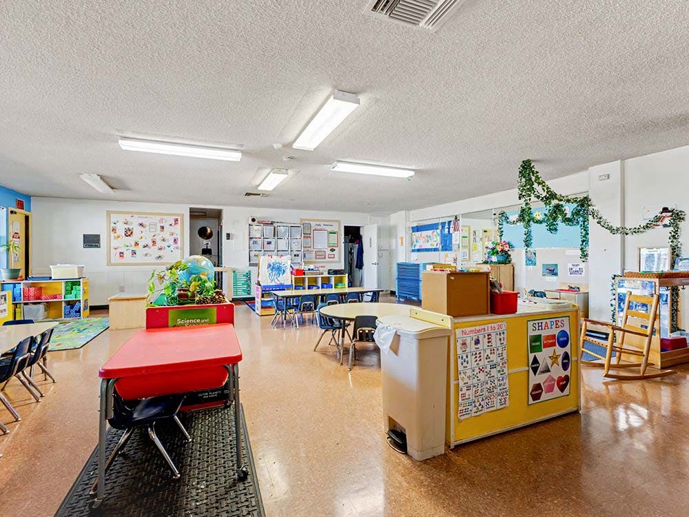 Classroom with child-sized furniture and learning materials