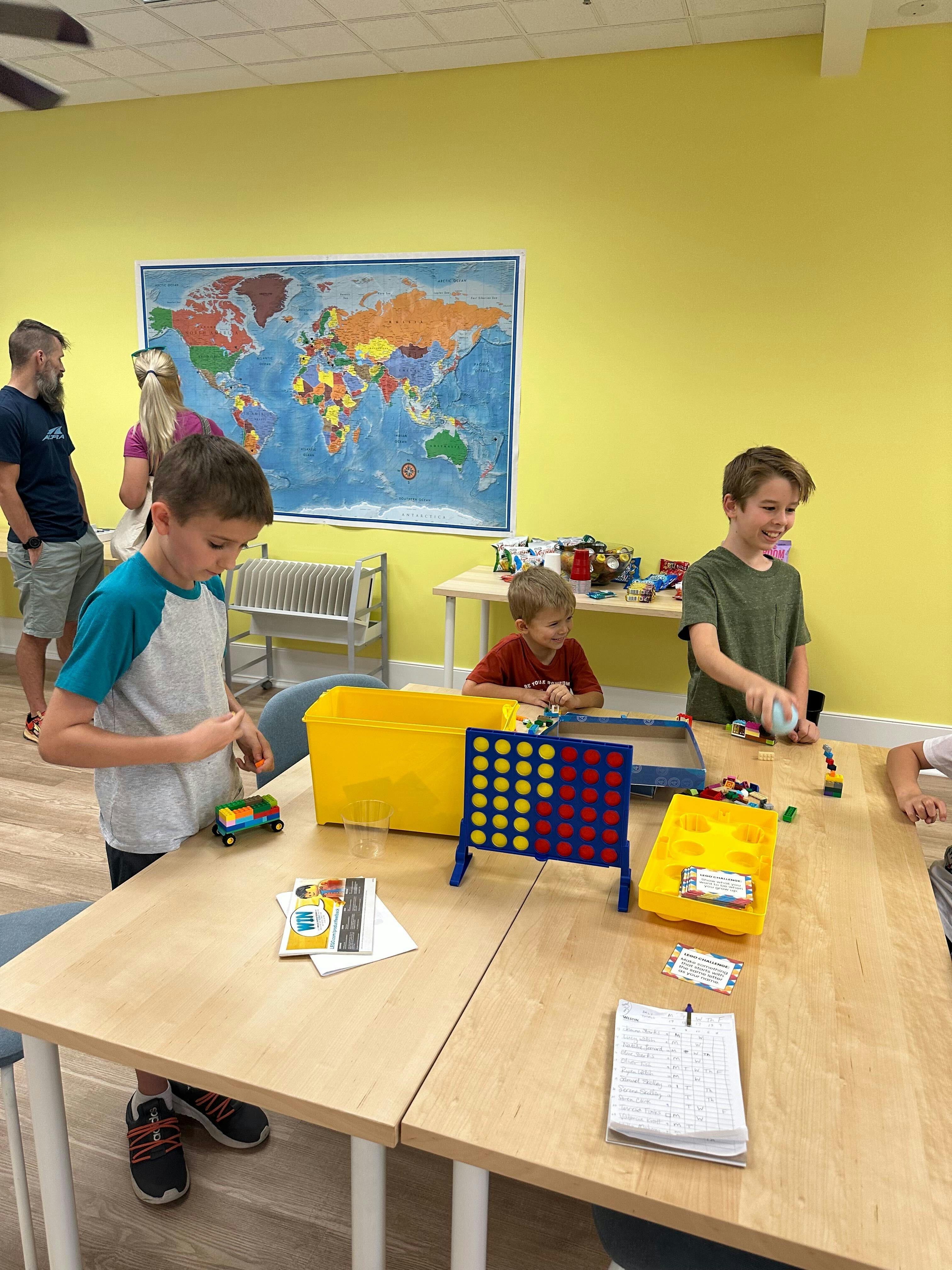 Children playing with toys at a table