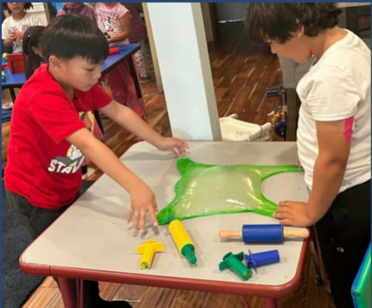Children playing with slime on a table