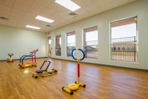 Indoor room with exercise equipment for children