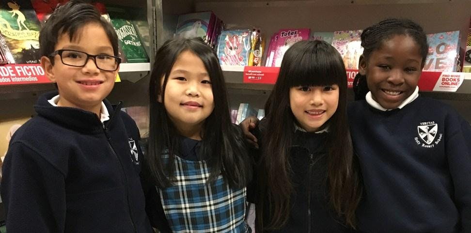 Four children standing together