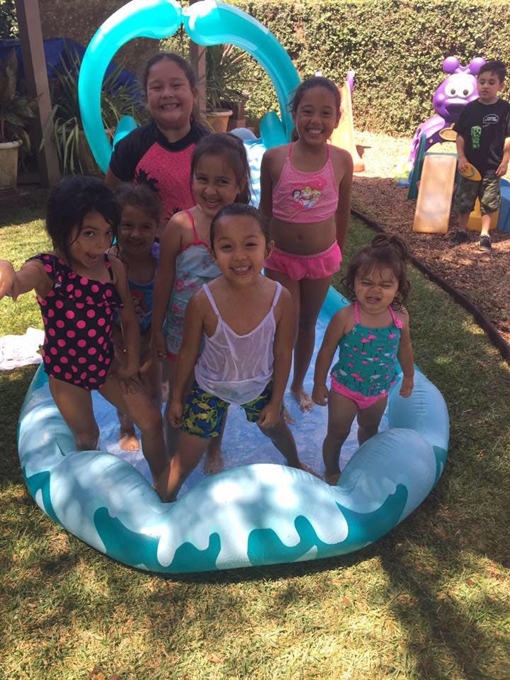Group of children playing in an inflatable pool