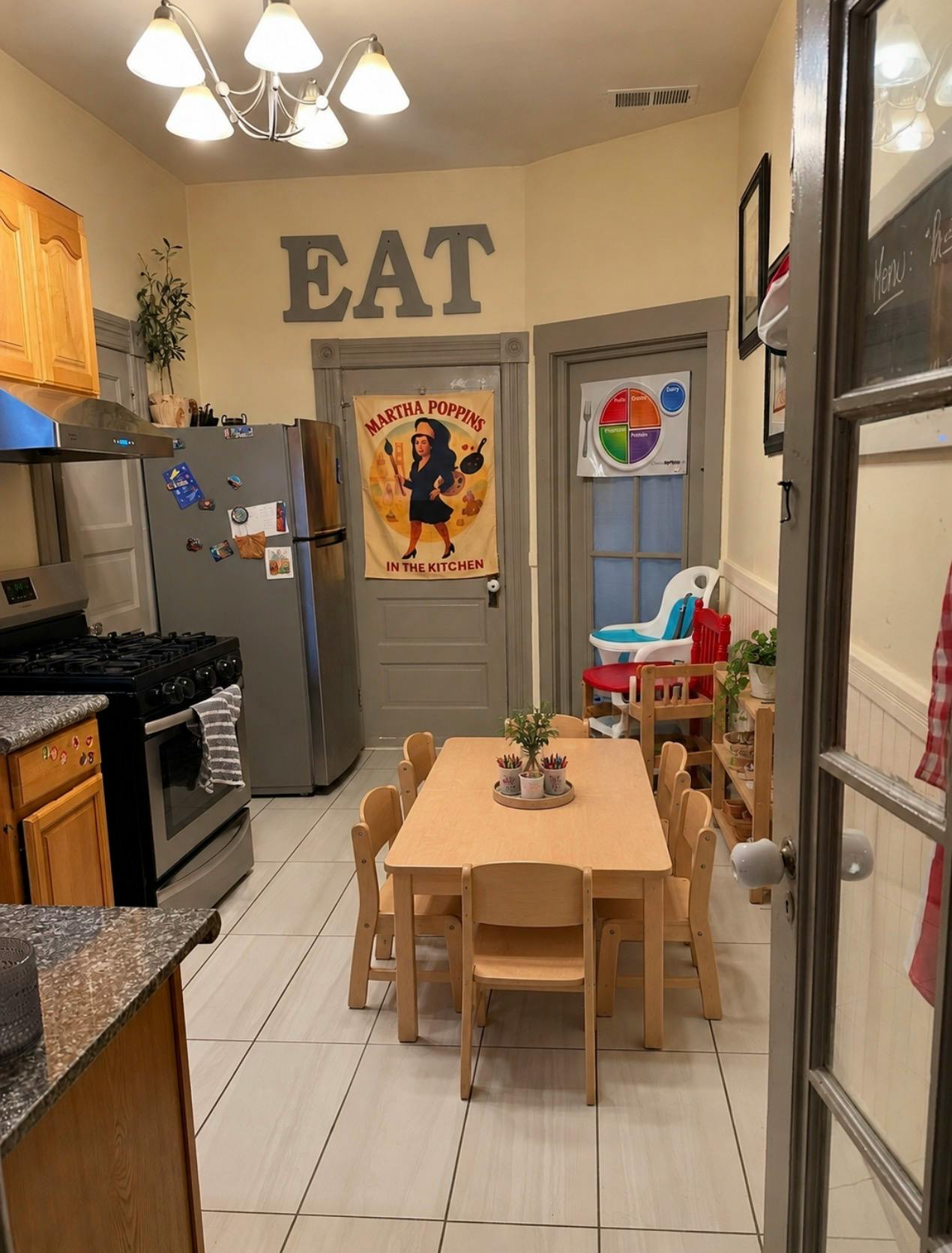 Small wooden table with several chairs in a kitchen area